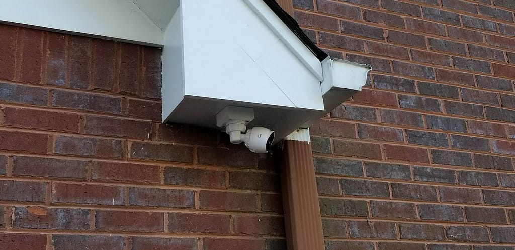 Trail cams and any security cameras, can be hidden under the eaves of your house. This provides shade, protection, and a high vantage point. 